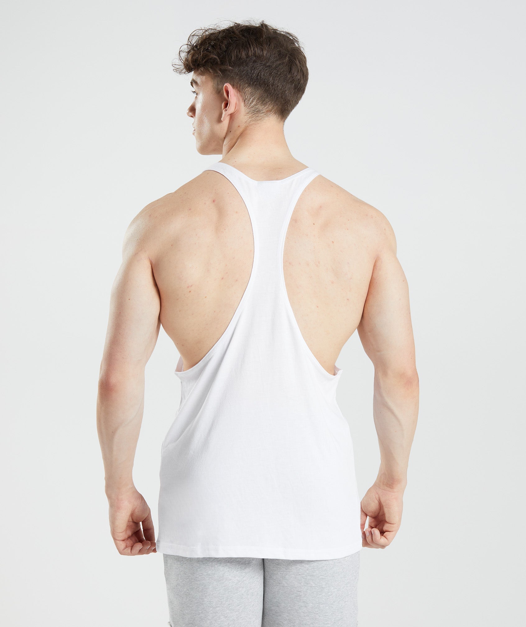 White Men's Gymshark Legacy Stringer Vest | GAHDUZ-642